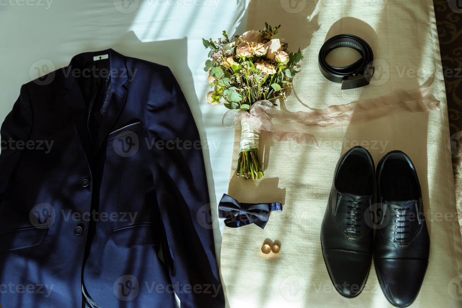 The groom's fees, jacket and watch photo