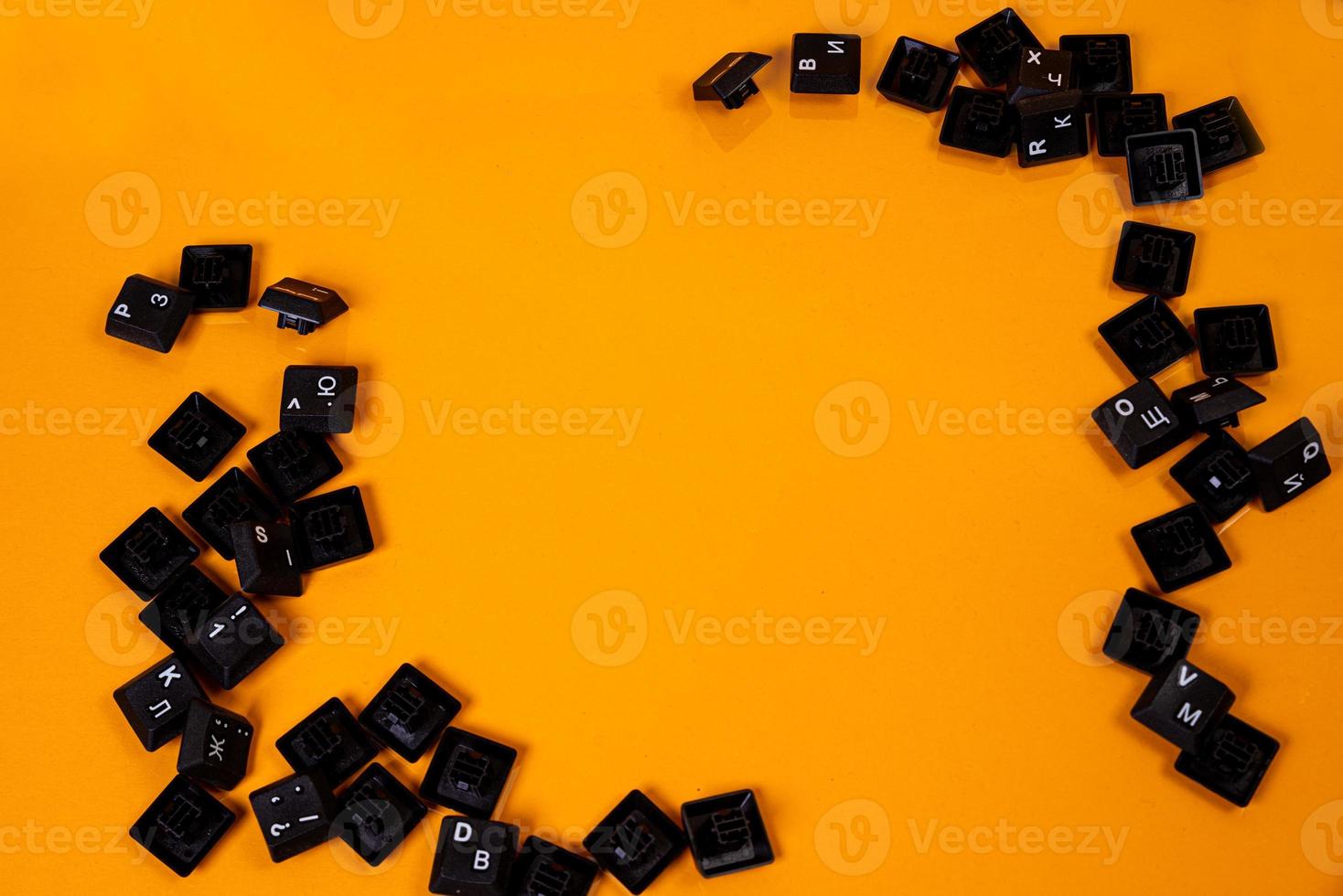 keyboard buttons on orange background photo