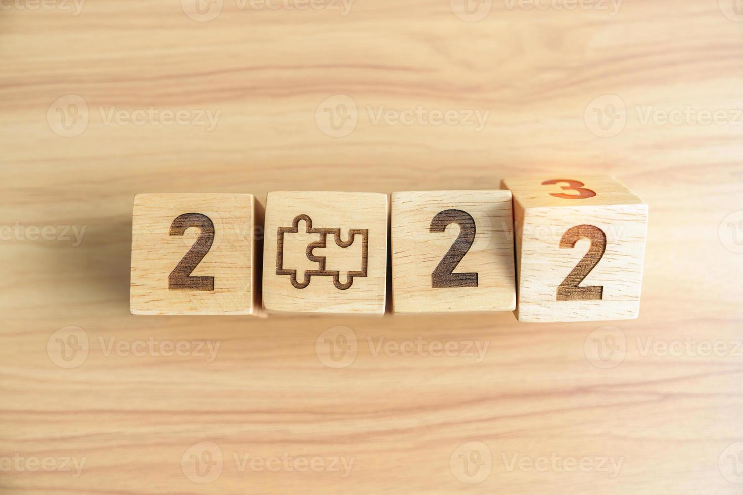 2022 change to 2023 block with jigsaw puzzle icon. Business Process, Team, teamwork, Goal, mission, Resolution, strategy, plan, Action, partnership, cooperation , brainstorm and New Year start photo