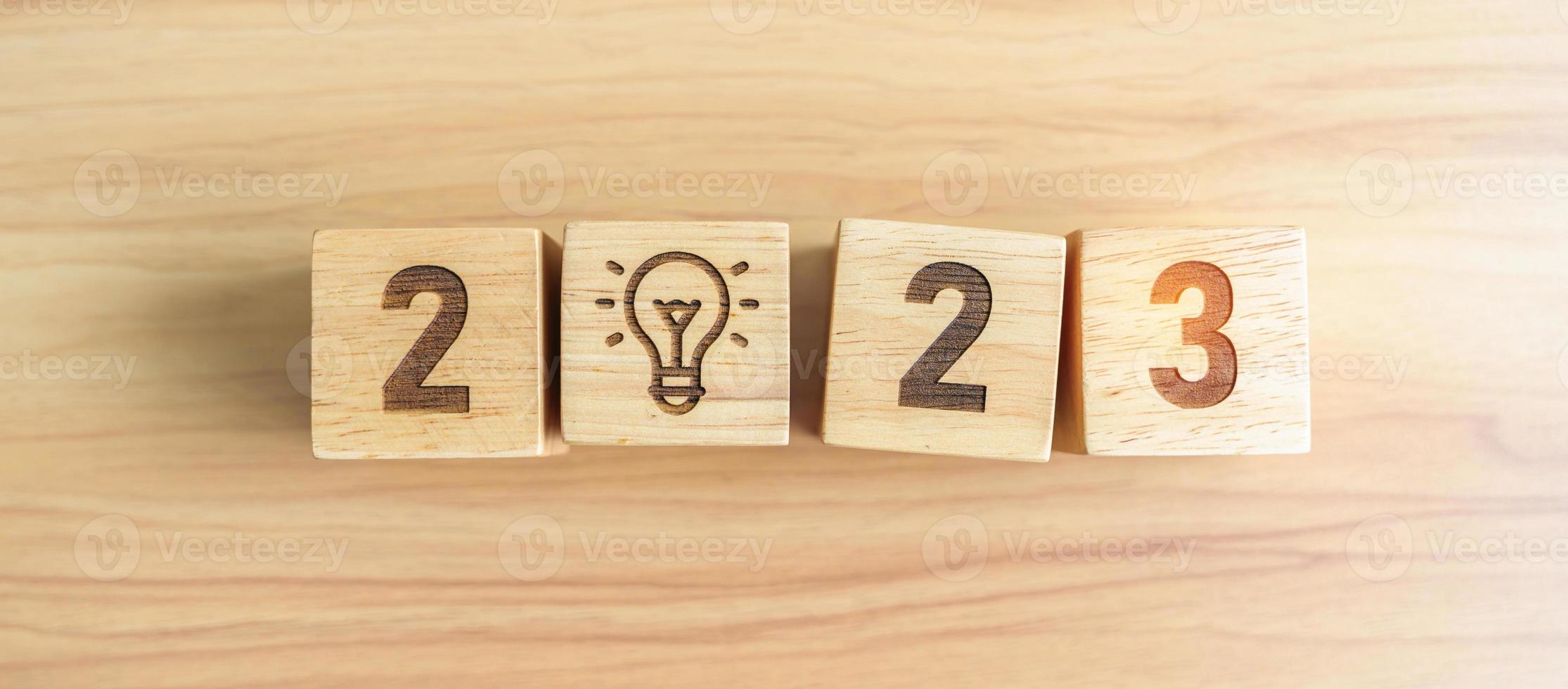 2023 block with lightbulb icon. Business Idea, Creative, Thinking, brainstorm, Goal, Resolution, strategy, plan, Action, change and New Year start concepts photo