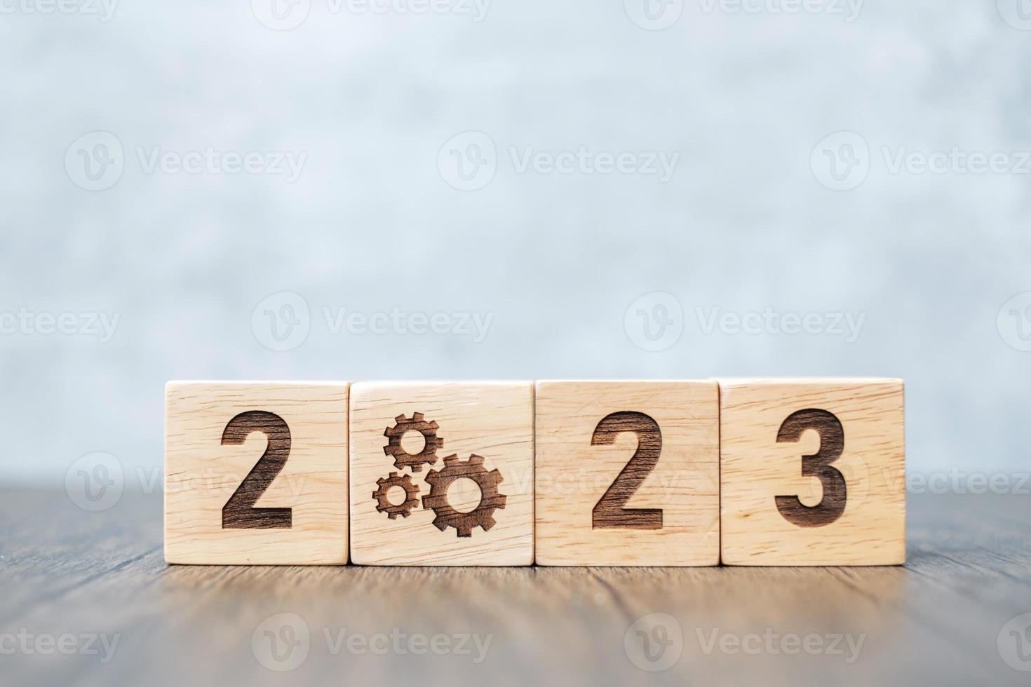2023 block with gear icon. Business Process, Team, teamwork, Goal, Target, Resolution, strategy, plan, Action, motivation, change, brainstorm and New Year start concepts photo