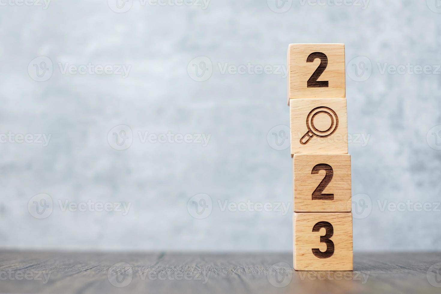2023 block with magnifying glass icon. SEO, Search Engine Optimization, hiring , Advertising, Idea, Strategy, marketing, Keyword, Content and New Year start concepts photo