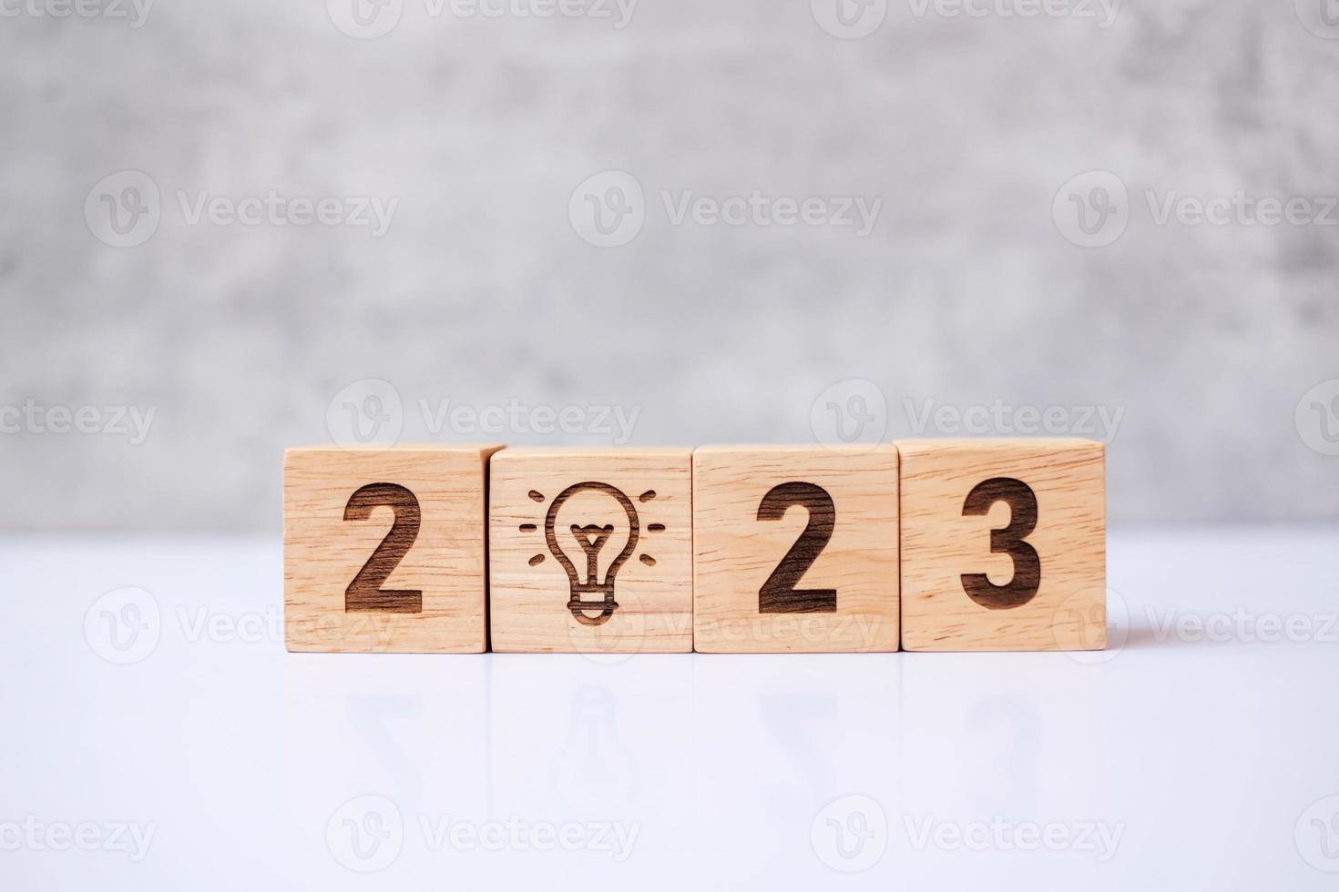 2023 block with lightbulb icon. Business Idea, Creative, Thinking, brainstorm, Goal, Resolution, strategy, plan, Action, change and New Year start concepts photo