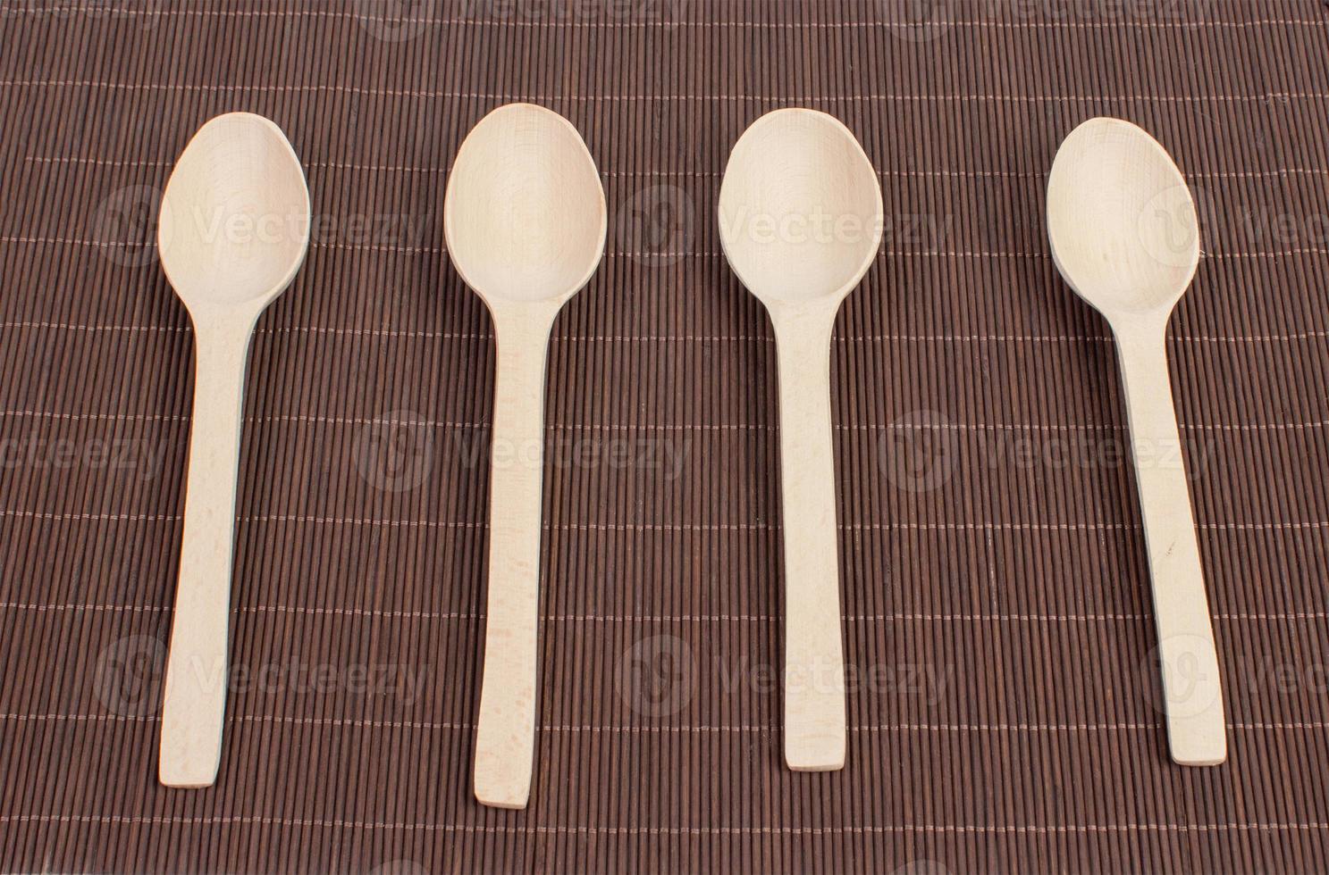 Wooden spoon on a table photo