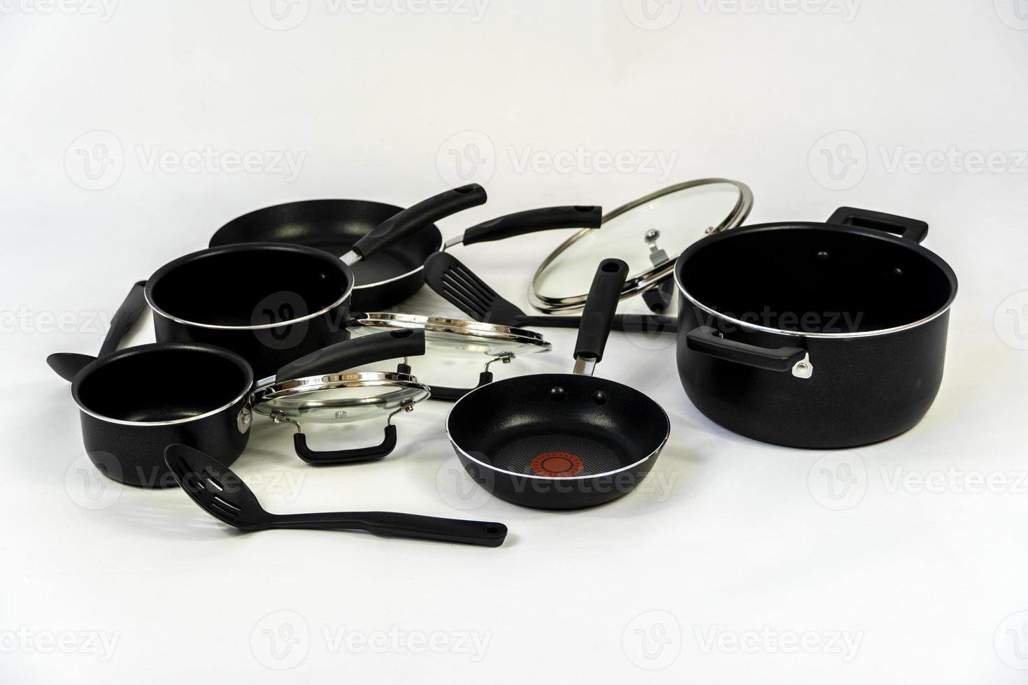 cookware set, steel dinner set isolated on white background, black metal cookware set photo