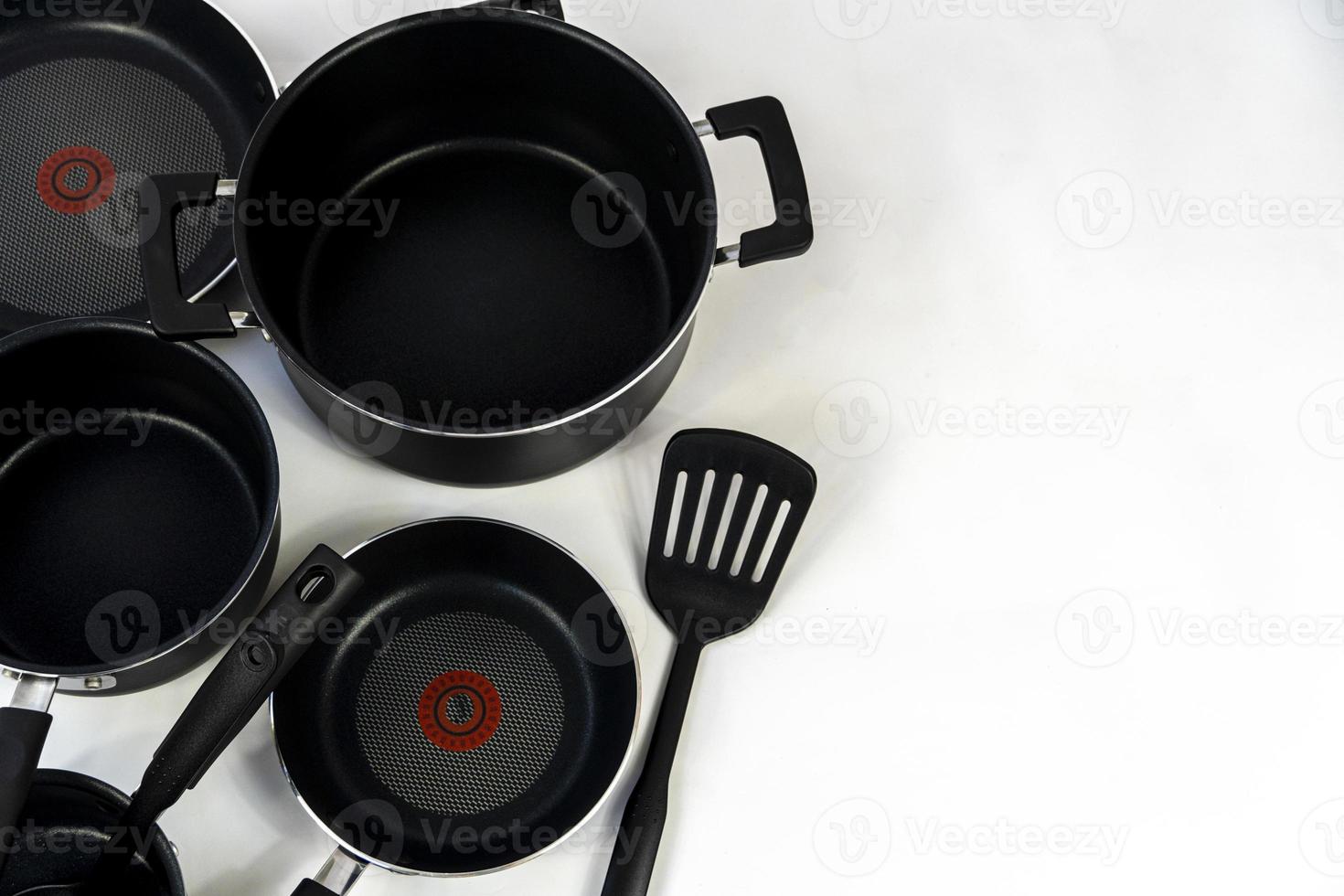 cookware set, steel dinner set isolated on white background, black metal cookware set photo