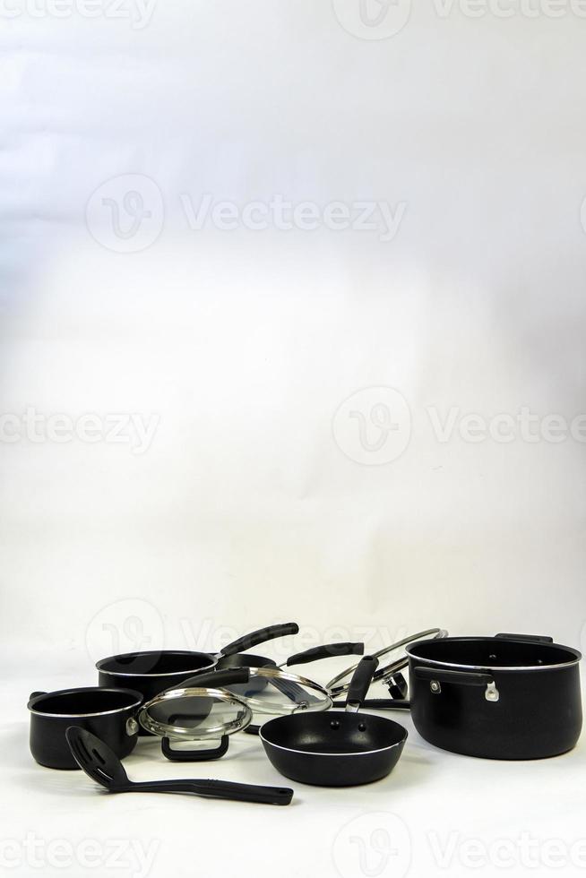 cookware set, steel dinner set isolated on white background, black metal cookware set photo