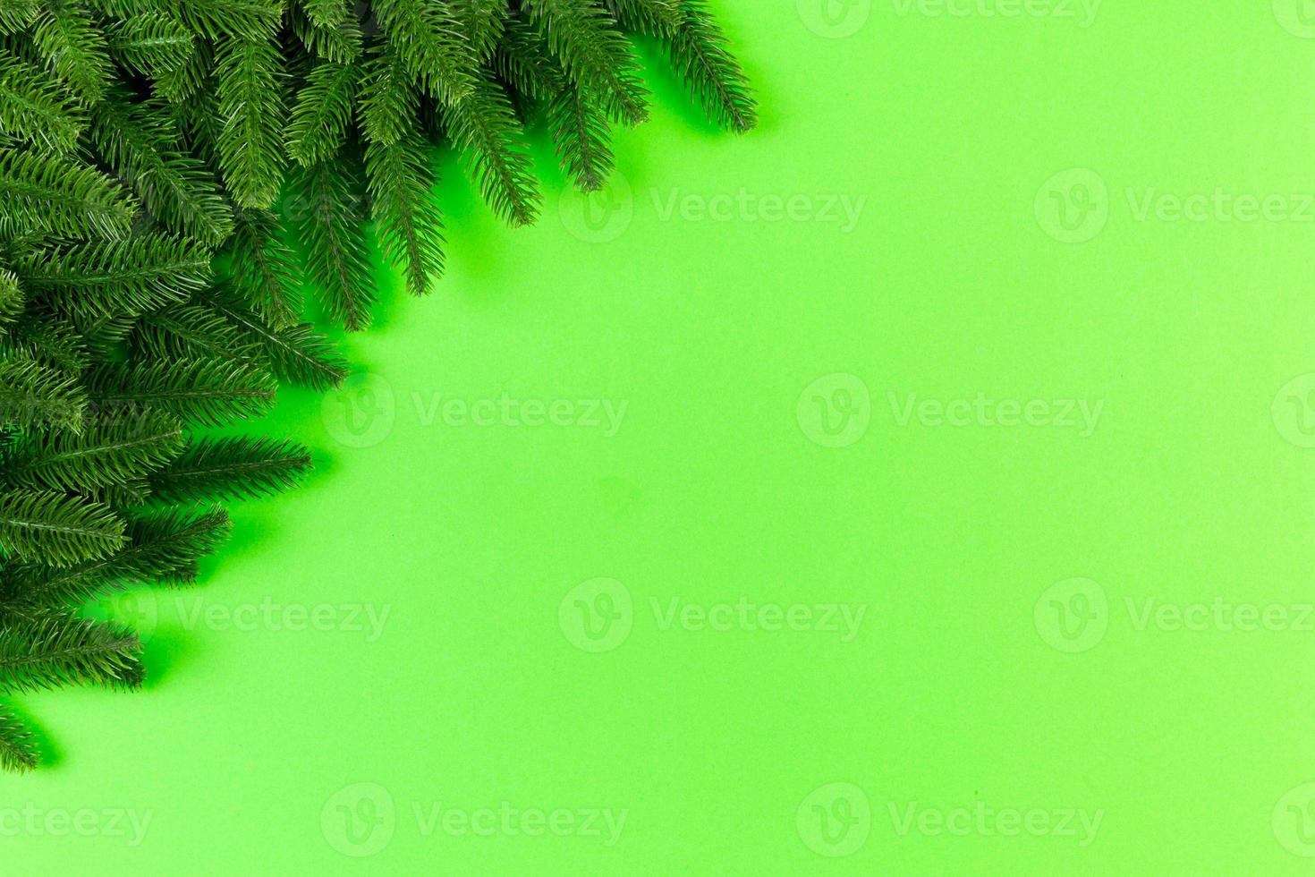 Top view of colorful festive background made of fir tree branch. Christmas holiday concept with copy space photo
