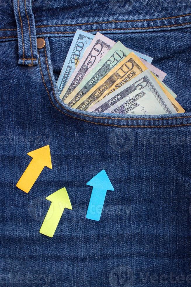 American dollar bills in jeans pocket background photo