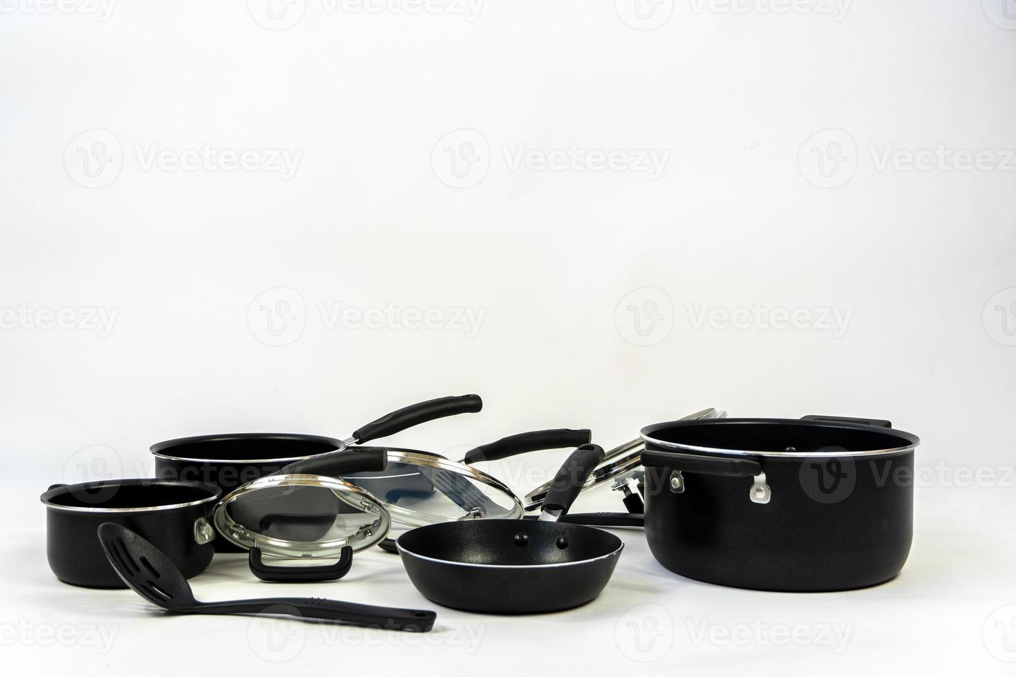 cookware set, steel dinner set isolated on white background, black metal cookware set photo