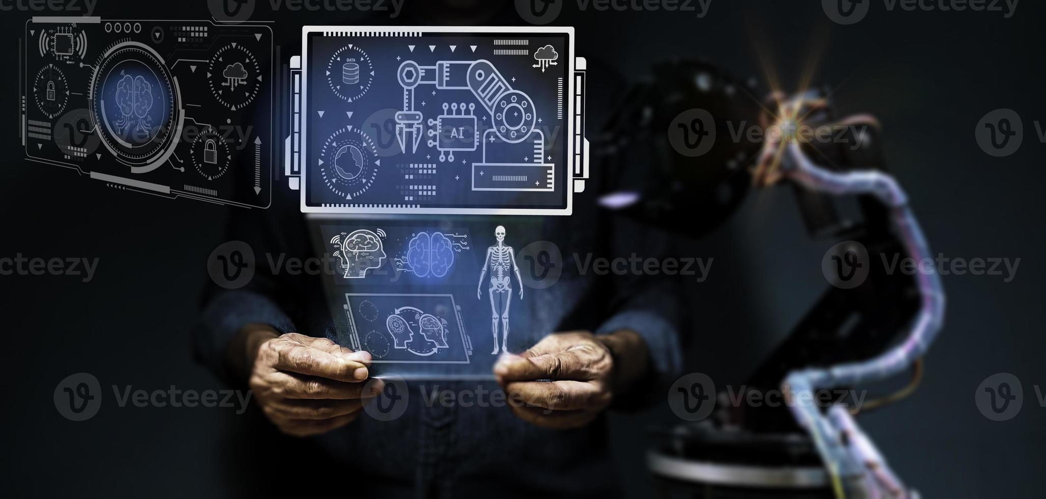 AI technology is what is used in the world today and in the future. Engineers use their fingers to operate on the displayed image. In order to divide the control of automatic robotic arms. photo