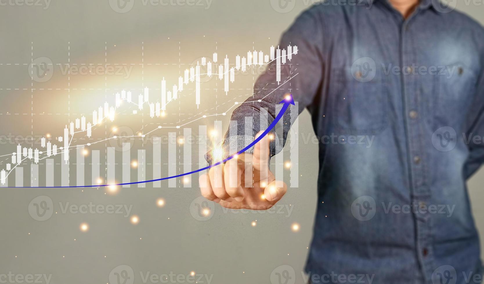 Hand of Businessman or merchant showing off virtual hologram stock. Buying and selling volume matters It is the heart of the pressure to make the graph move. with increased copy space photo