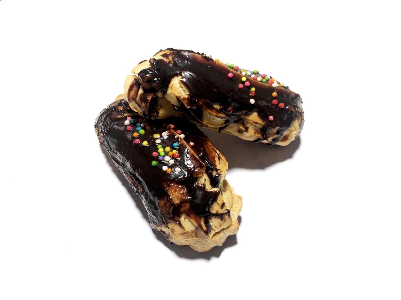 Chocolate eclair donuts on a white background 13851902 Stock Photo at