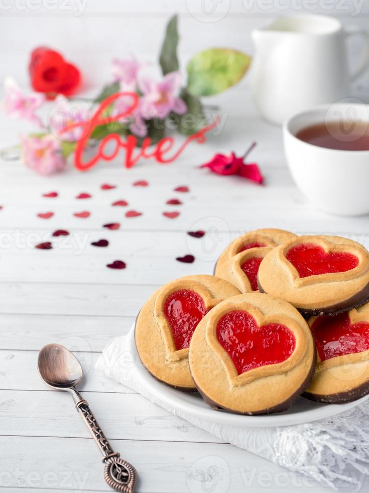 Homemade Cookies with a Red Jam Heart Valentine's Day Cup of tea photo