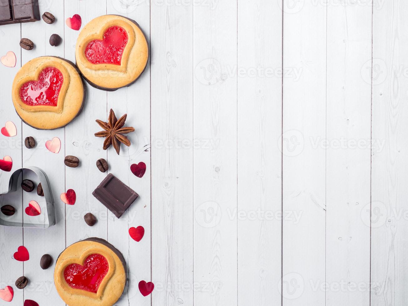 Homemade Cookies with a Red Jam Heart Valentine's Day Coffee and Chocolate Star Anise Copy space Flat lay photo