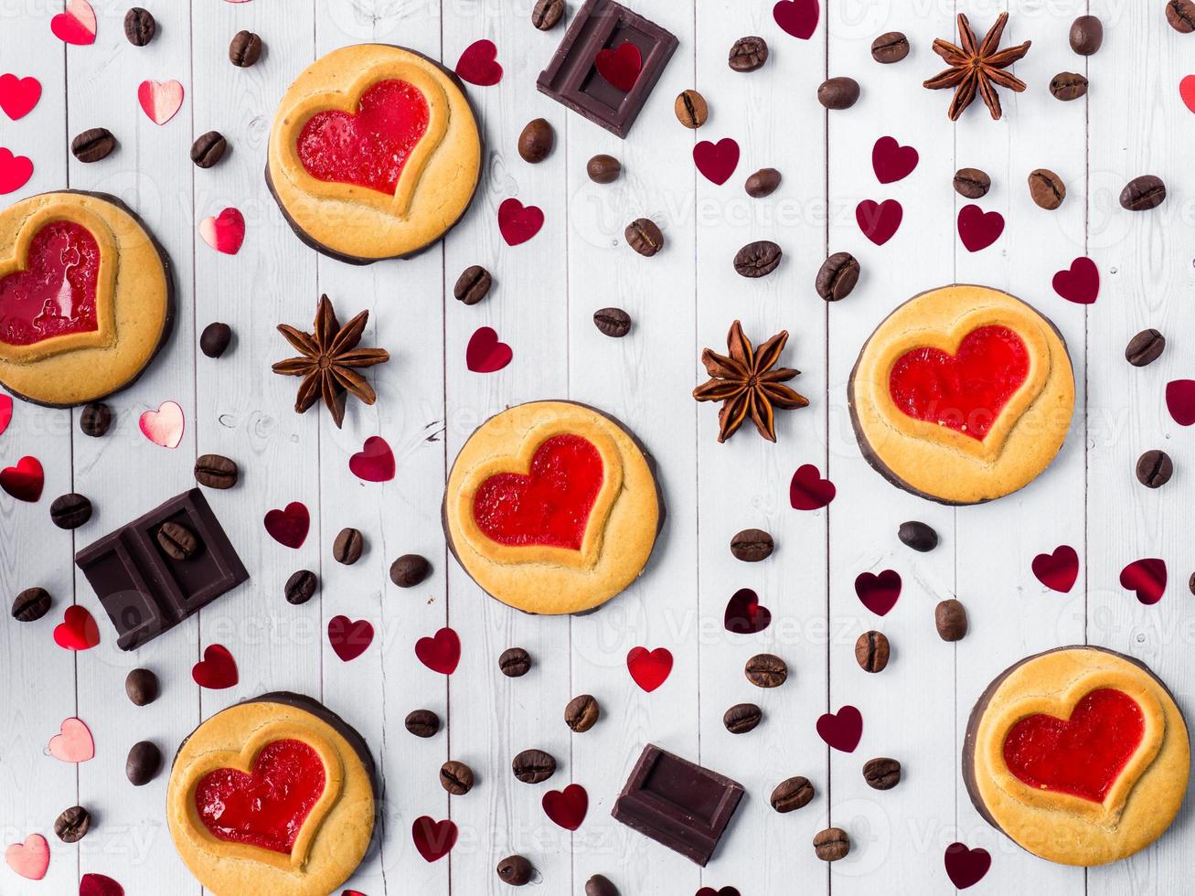 Homemade Cookies with a Red Jam Heart Valentine's Day Coffee and Chocolate Star Anise Copy space Flat lay photo