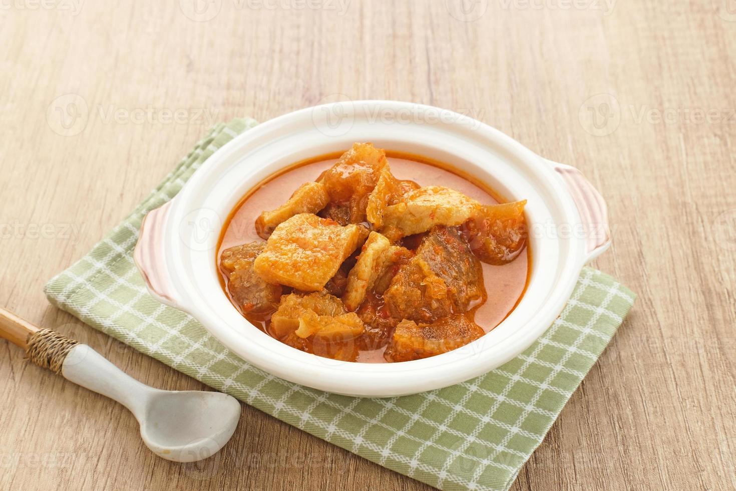 Sambal Goreng Krecek Tahu, Indonesian traditional food, made from cattle skin crackers with tofu and coconut milk. Served in bowl. photo