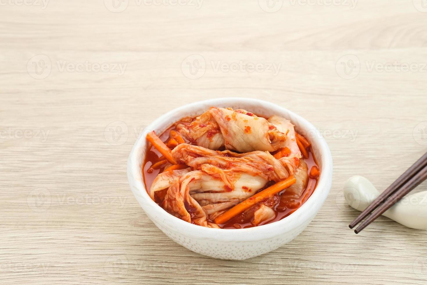 Kimchi or Kimci, a traditional Korean food, pickled fermented vegetables with a spicy seasoning photo