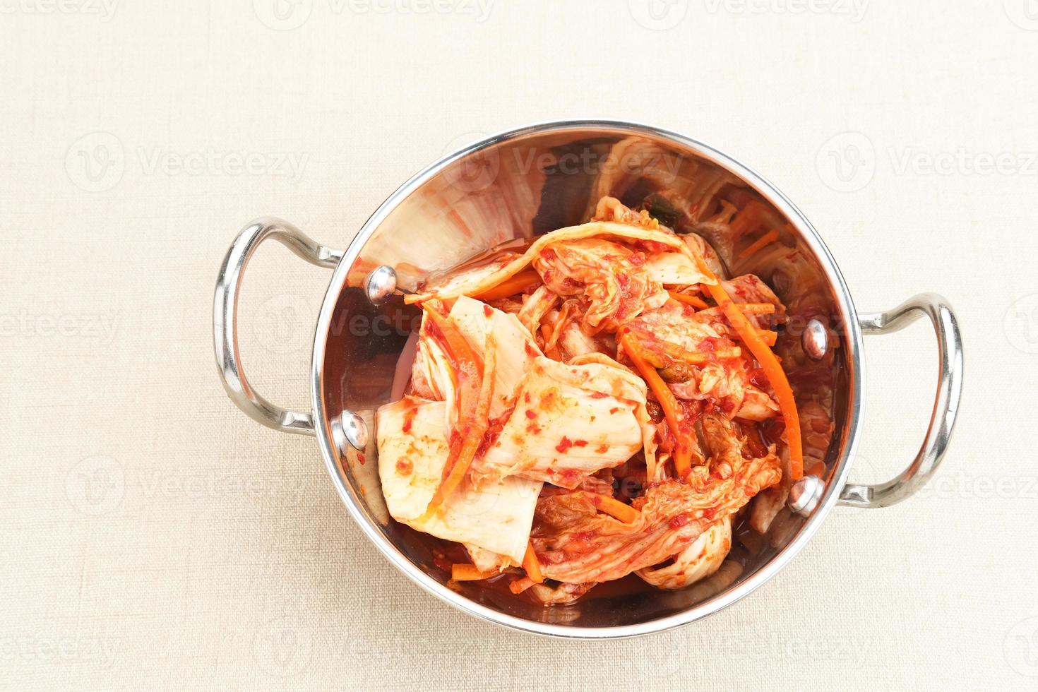 Kimchi or Kimci, a traditional Korean food, pickled fermented vegetables with a spicy seasoning photo