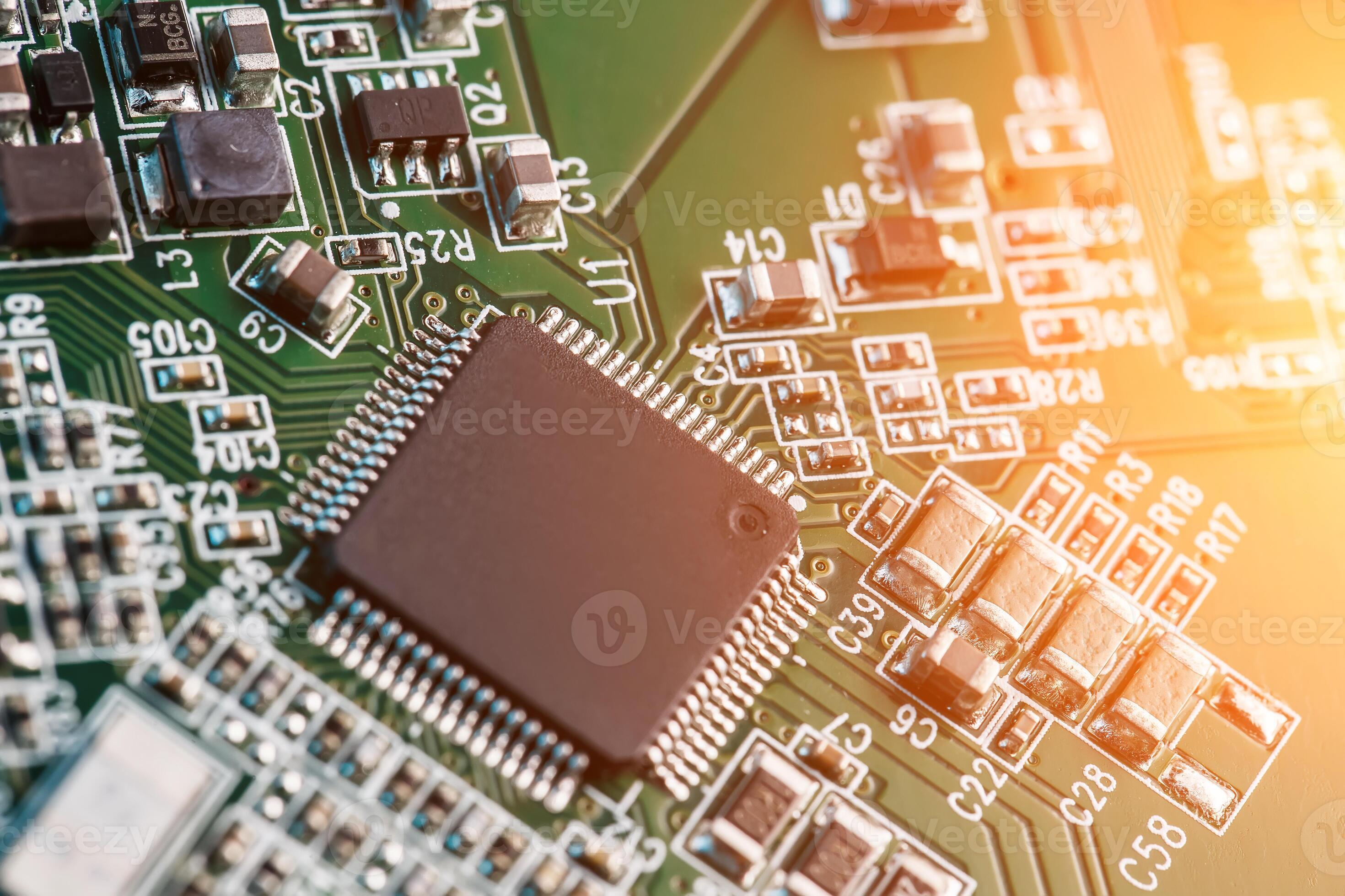 Electronic circuit board close up. Processor, chips and capacitors