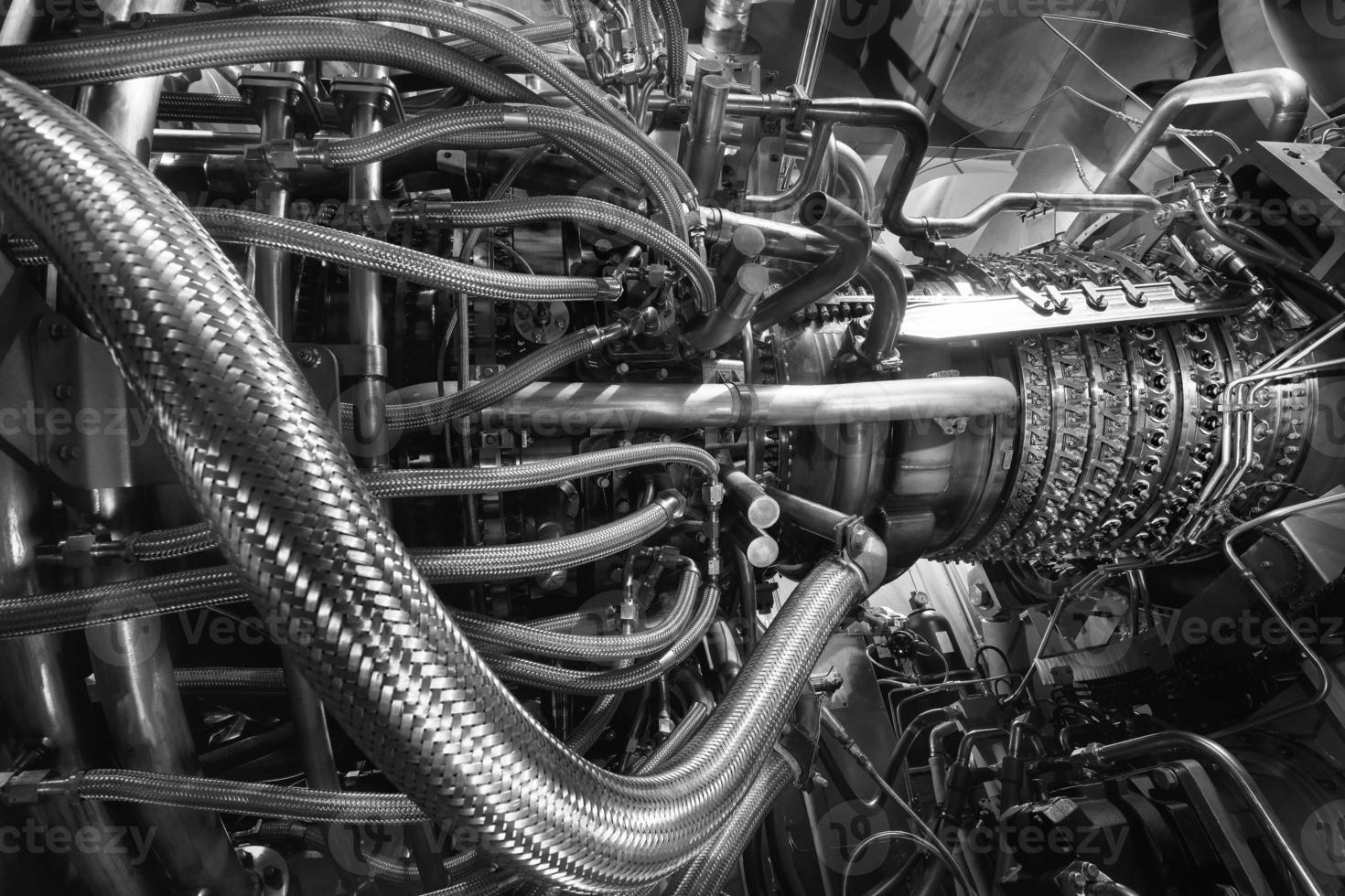 Gas turbine engine of feed gas compressor located inside pressurized enclosure, Black white monochrome. The gas turbine engine used in offshore oil and gas central processing platform. photo