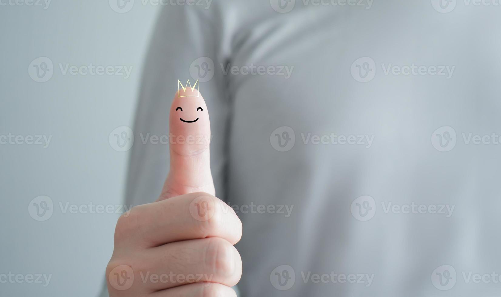 Man show thumb up with happy smiling face and crown. Good, Positive emotion. Customer Experience and Satisfaction, Best Excellent Services Rating concept. photo