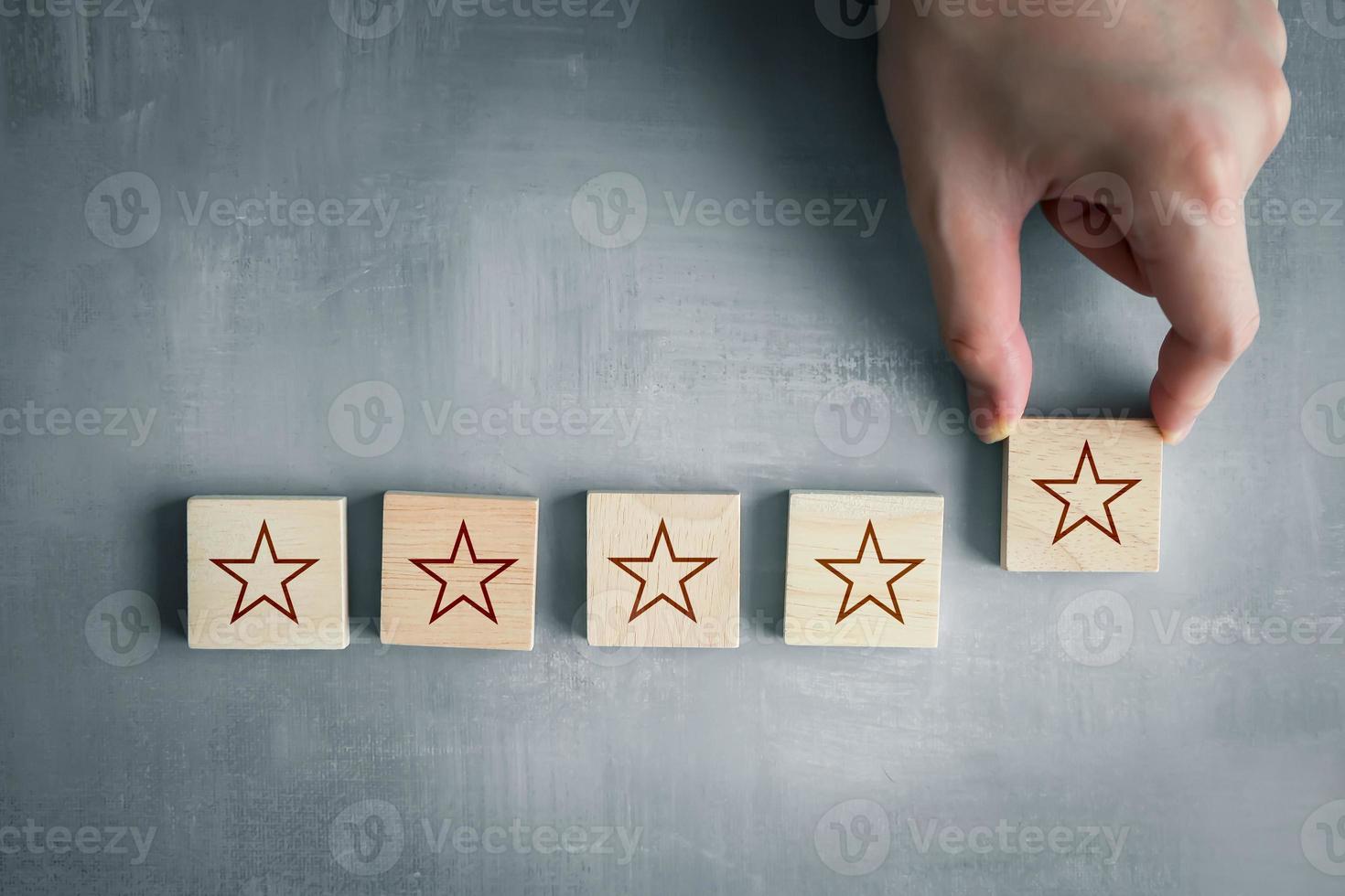 Customer Experience, Satisfaction, Feedback, Review, Evaluation concept. Client giving star to five stars for increase rating. The best excellent business services rating customer experience. photo