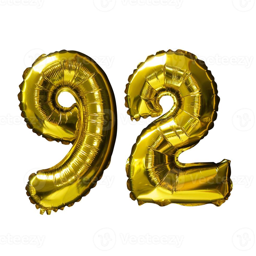 92 Golden number helium balloons isolated background. Realistic foil and latex balloons. design elements for party, event, birthday, anniversary and wedding. photo