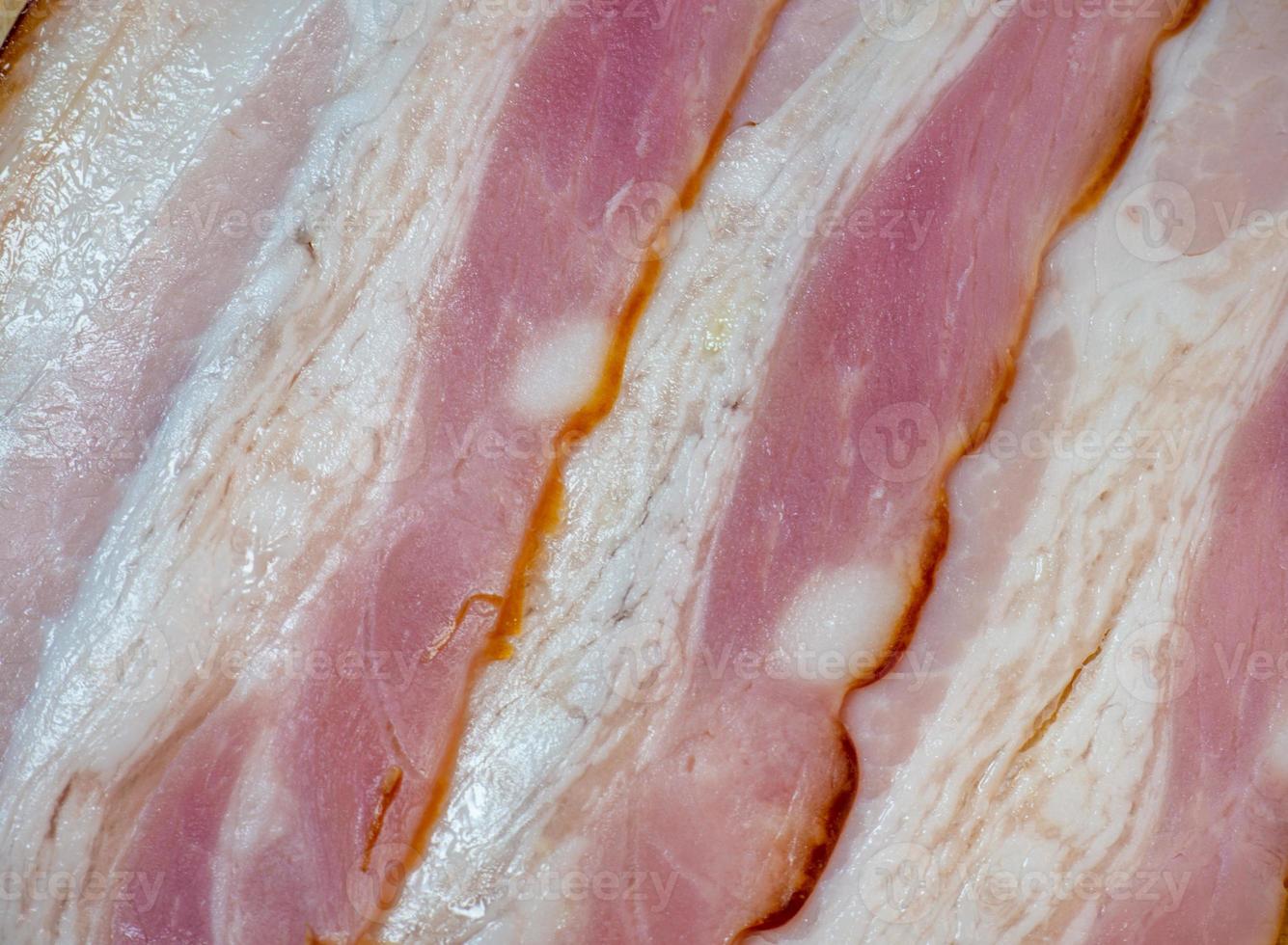 Curvy cut folded into rolls. Pork on a kitchen board . Still life of meat. Pork belly appetizer. Bacon background photo