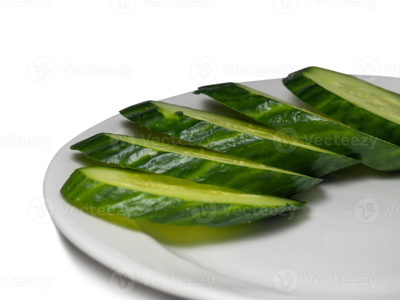 Ripe cucumber on cutting board photo