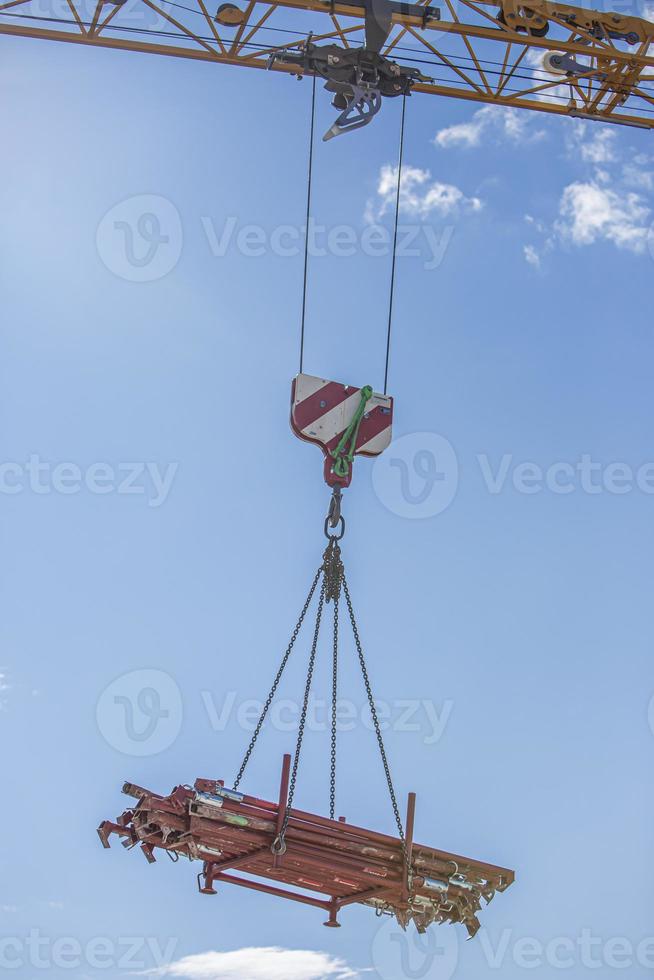 Industrial area. Unloading by the crane of the production equipmentin Graz, Austria. photo