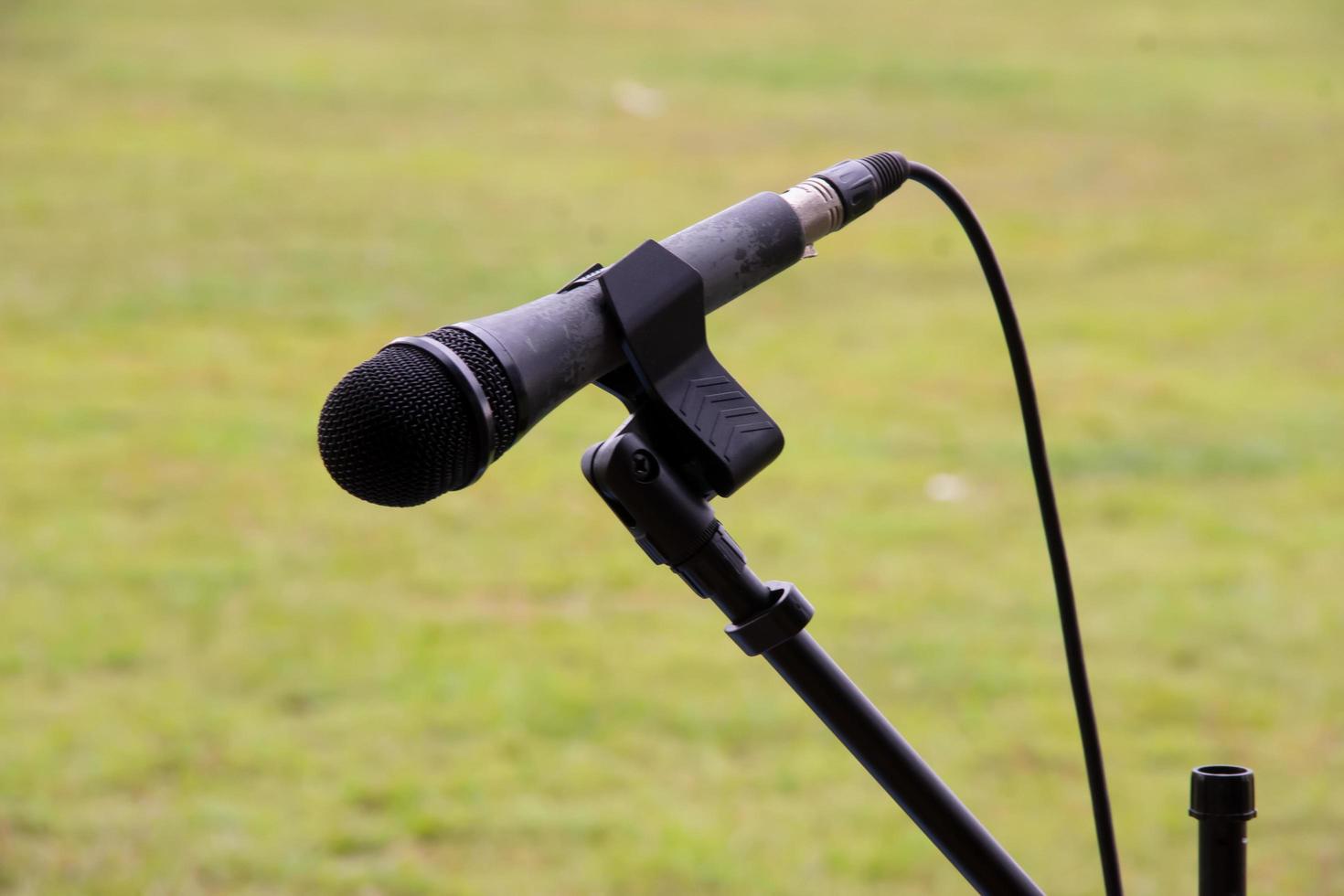 microphone ready to use on a celebration on a green grass background. photo