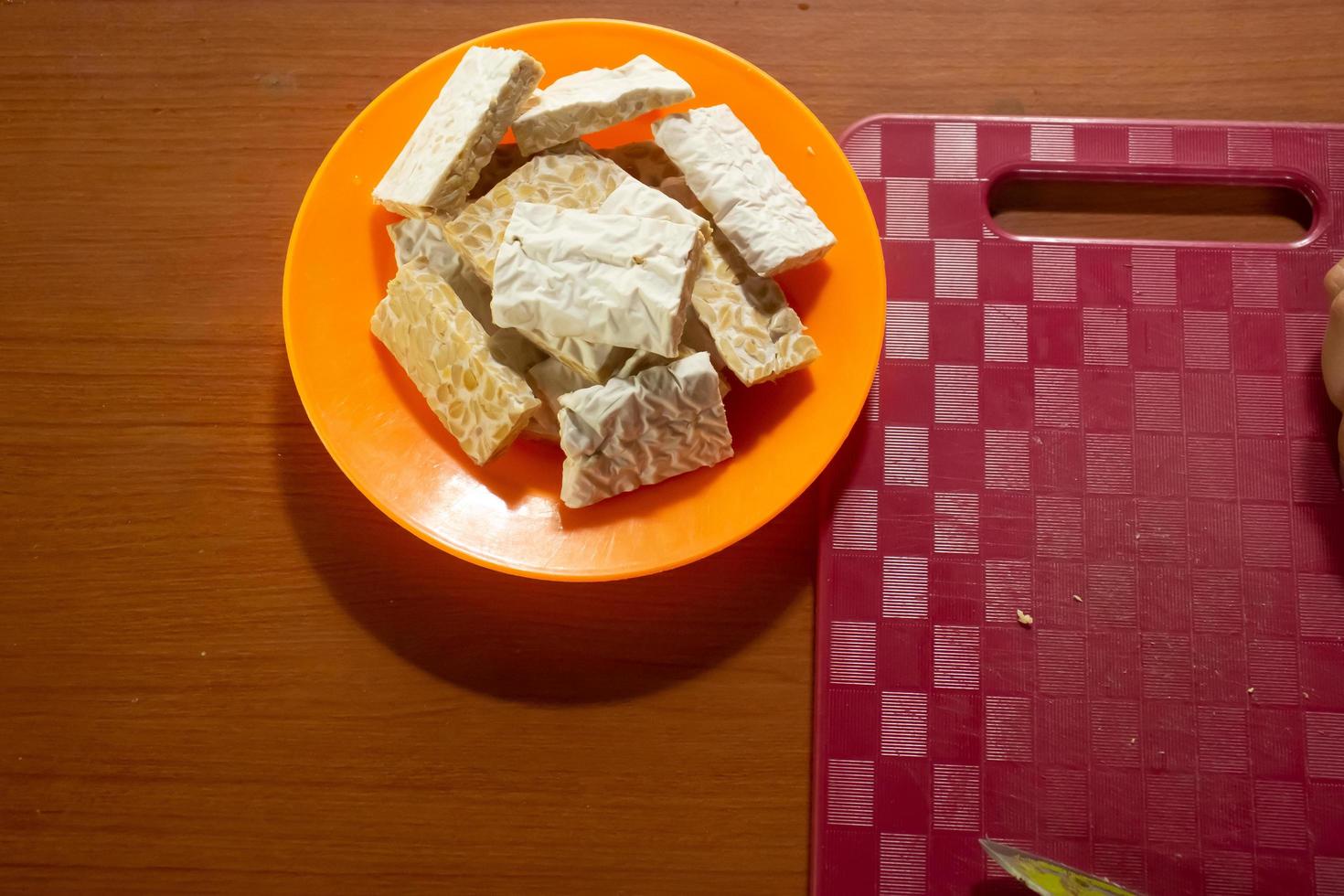 tempeh in a plastic container that is placed on the table photo