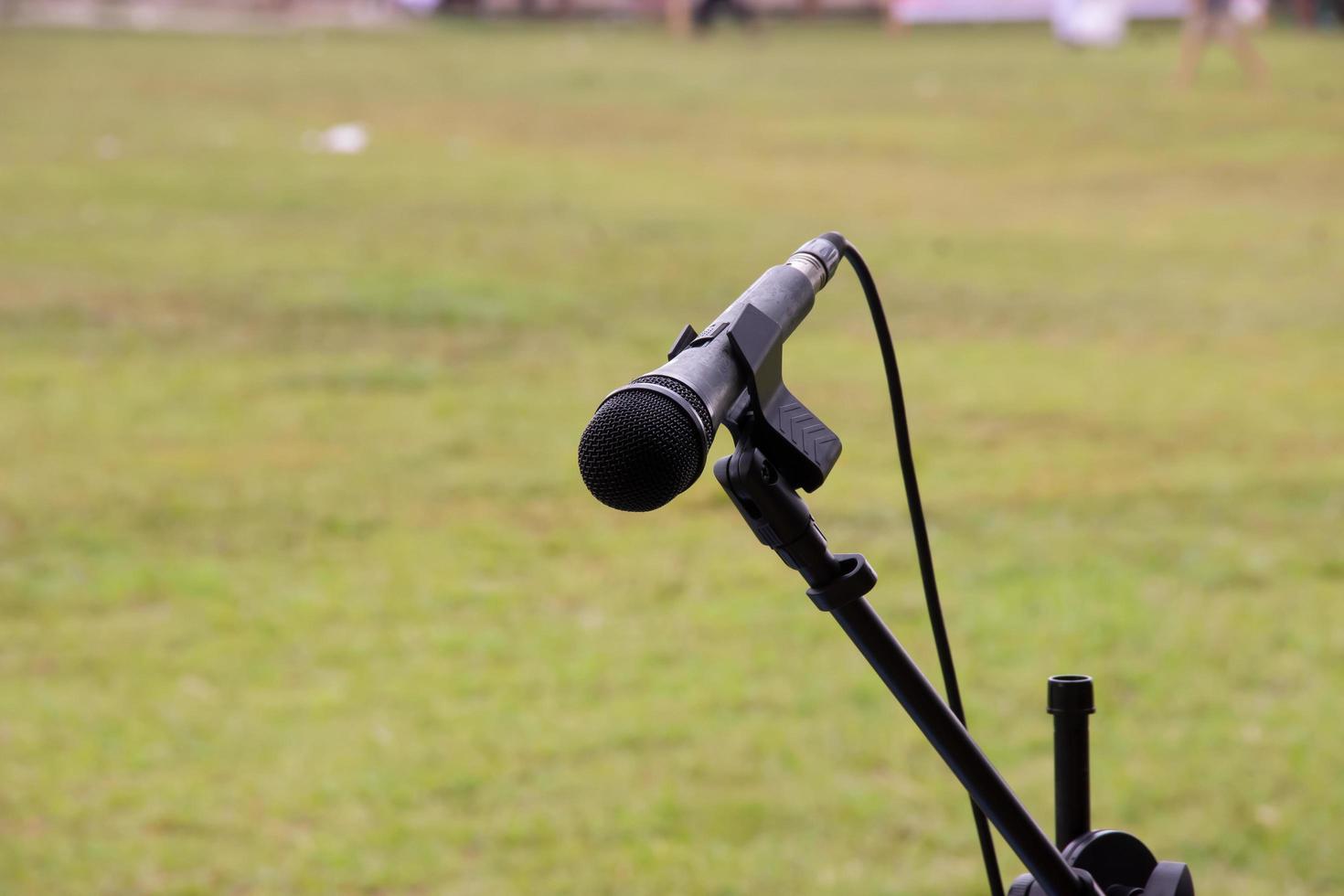 microphone ready to use on a celebration on a green grass background. photo