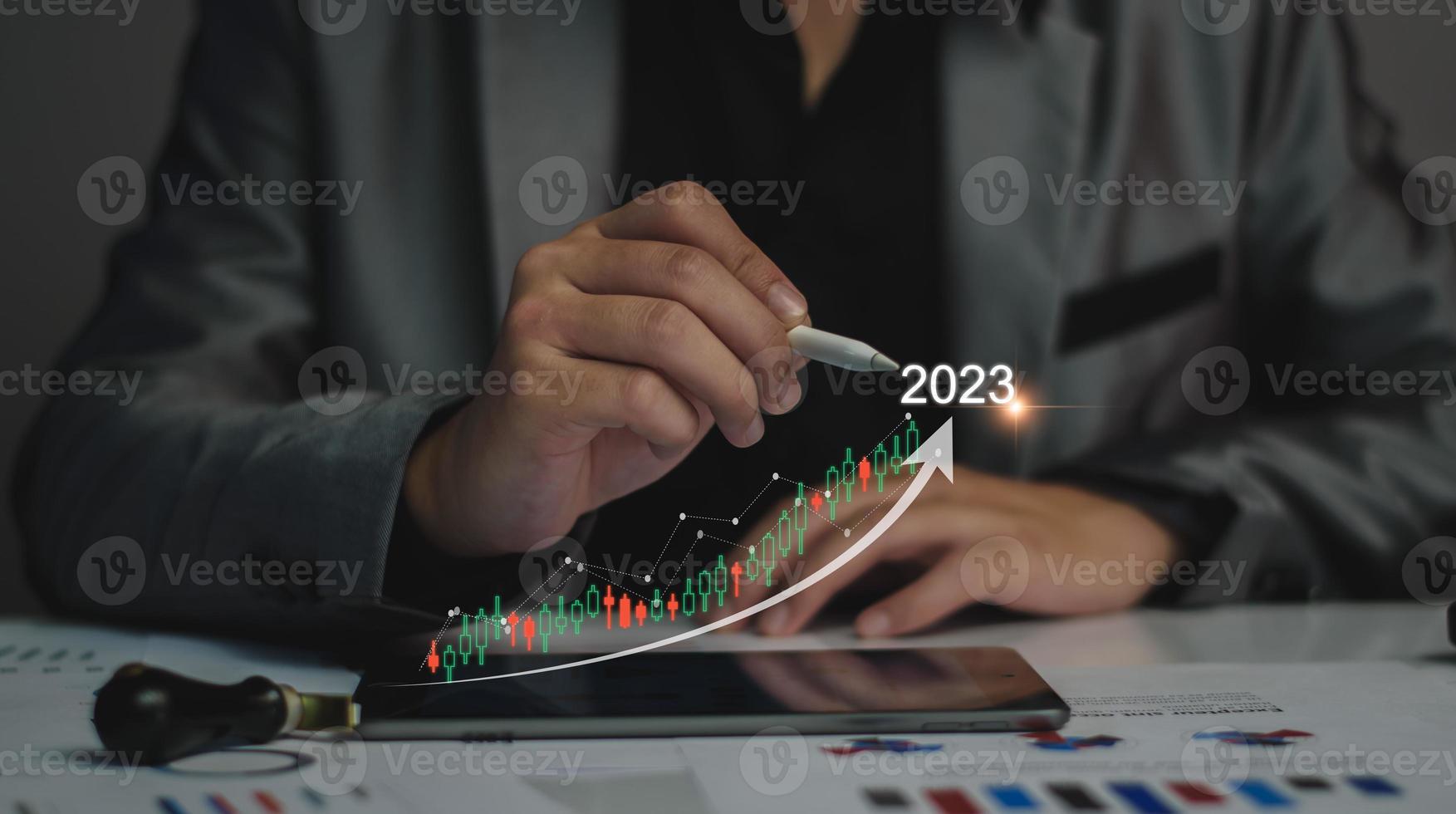 Digital marketing 2023 goals. Businessman analyzing internet marketing online, 2023 business planning, business skyrocket, online stock market analysis, stock chart next year, digital stock trading photo