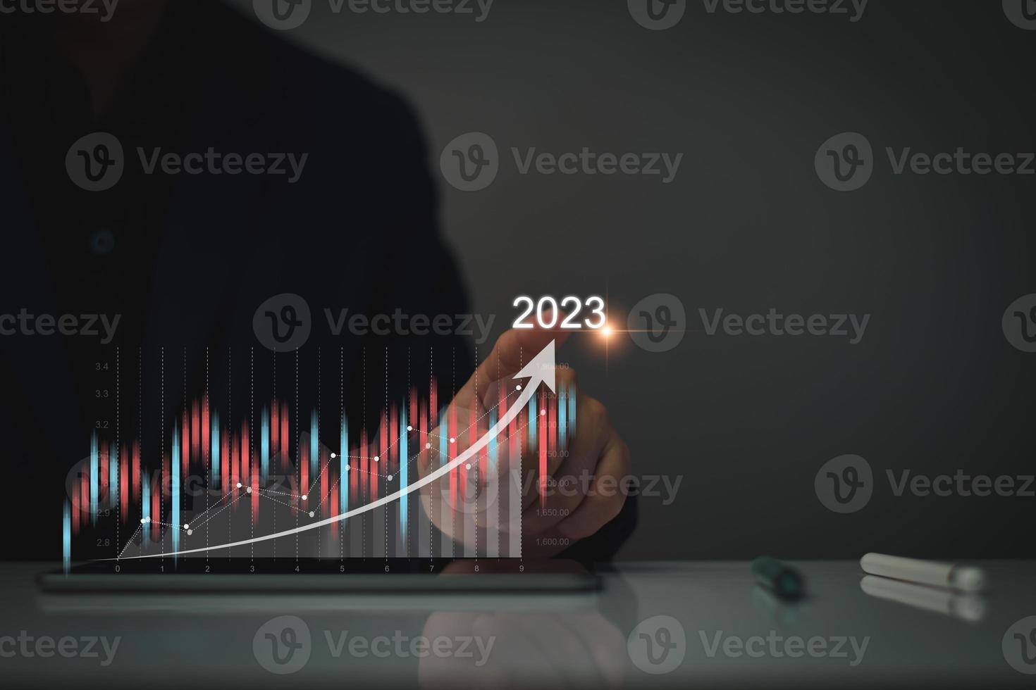 Digital marketing 2023 goals. Businessman analyzing internet marketing online, 2023 business planning, business skyrocket, online stock market analysis, stock chart next year, digital stock trading photo