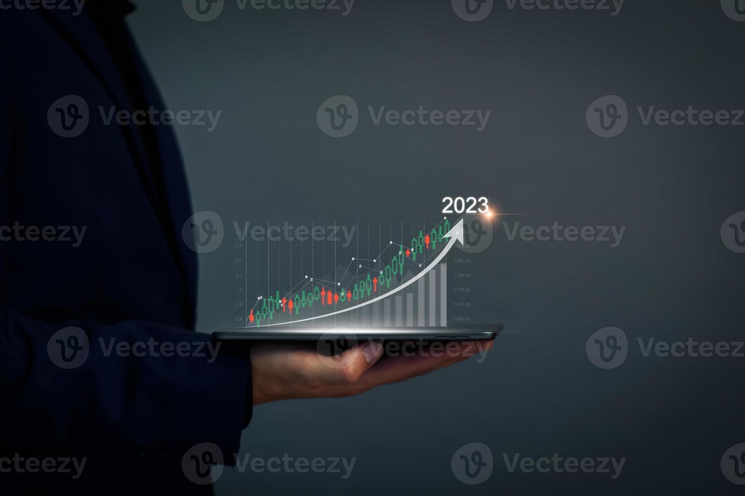 Digital marketing 2023 goals. Businessman analyzing internet marketing online, 2023 business planning, business skyrocket, online stock market analysis, stock chart next year, digital stock trading photo