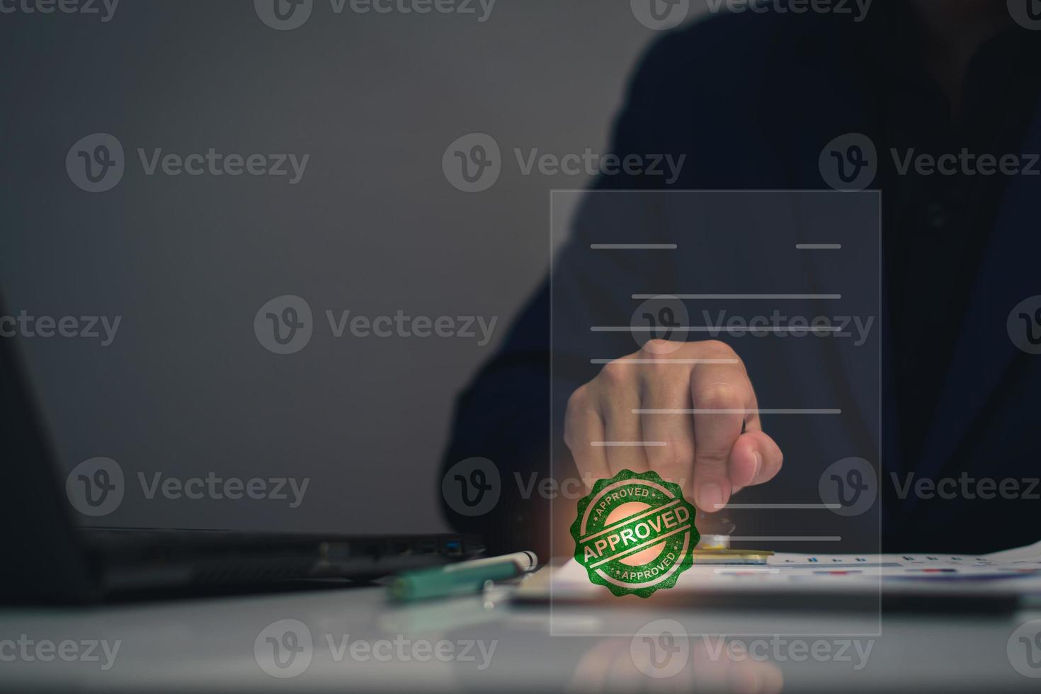 Business approved concept. Manager hand stamping with approved stamp on certificate document public paper, investment certificate, business document, certificate approved, investment allowed. photo