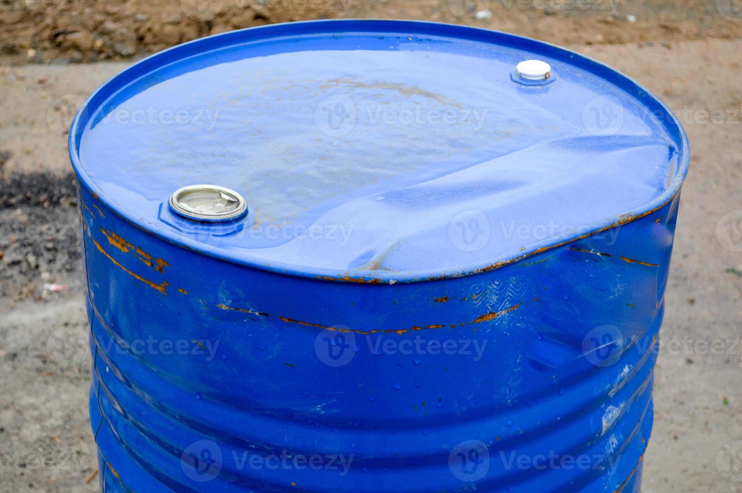 Large metal iron industrial blue round 200 liter barrel for storing gasoline and diesel fuel, liquid photo