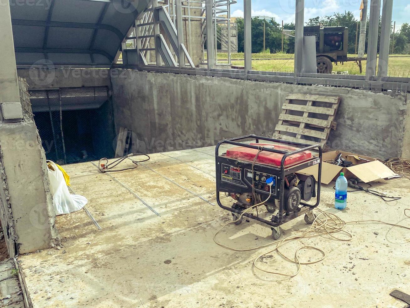 construction of an underground pedestrian crossing. construction equipment stands on the steps underground. earth drilling, erection of concrete structures photo