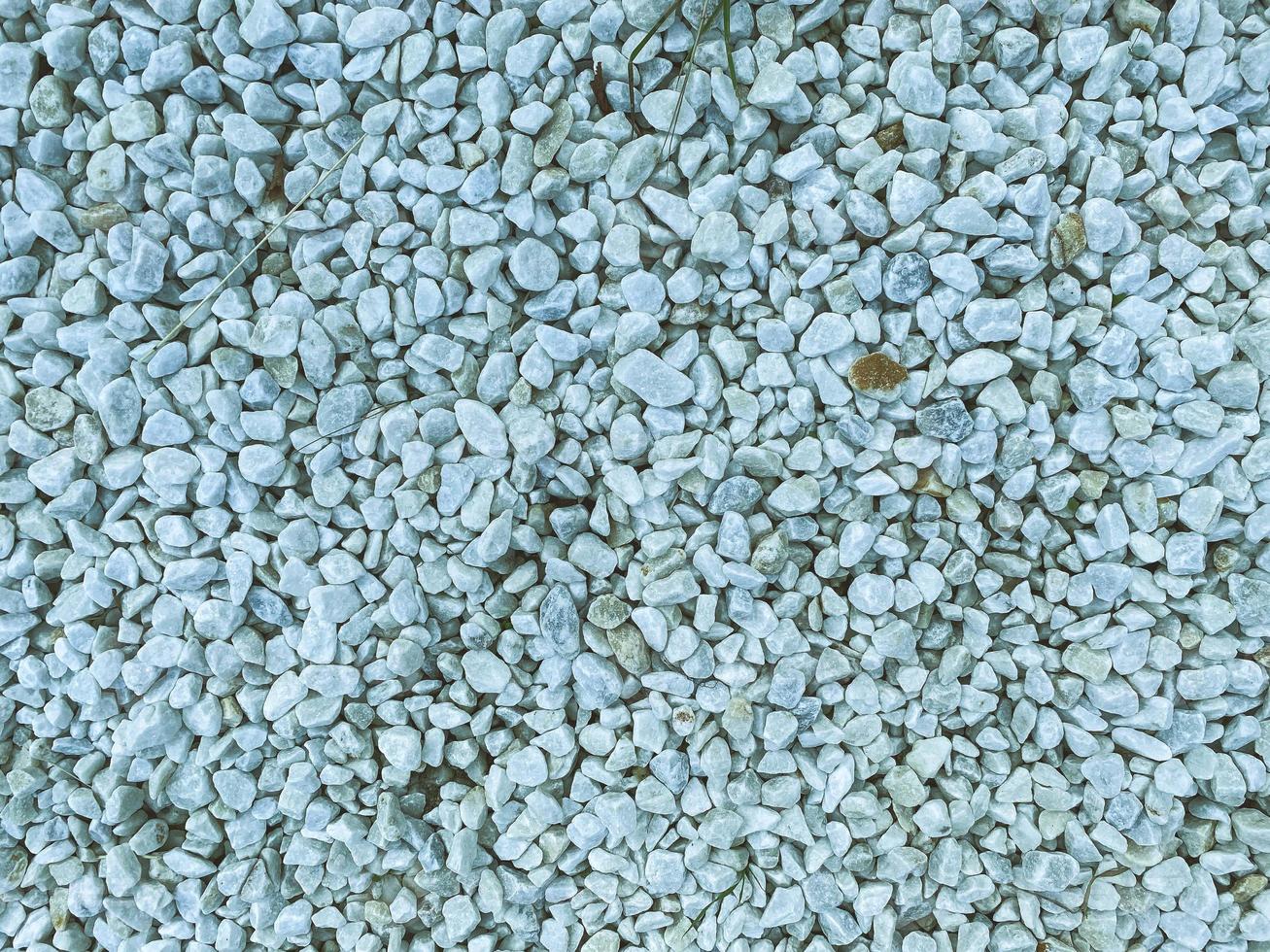 texture, background. small white stones. natural natural material. stones of even shape and uniform white color. volumetric texture photo