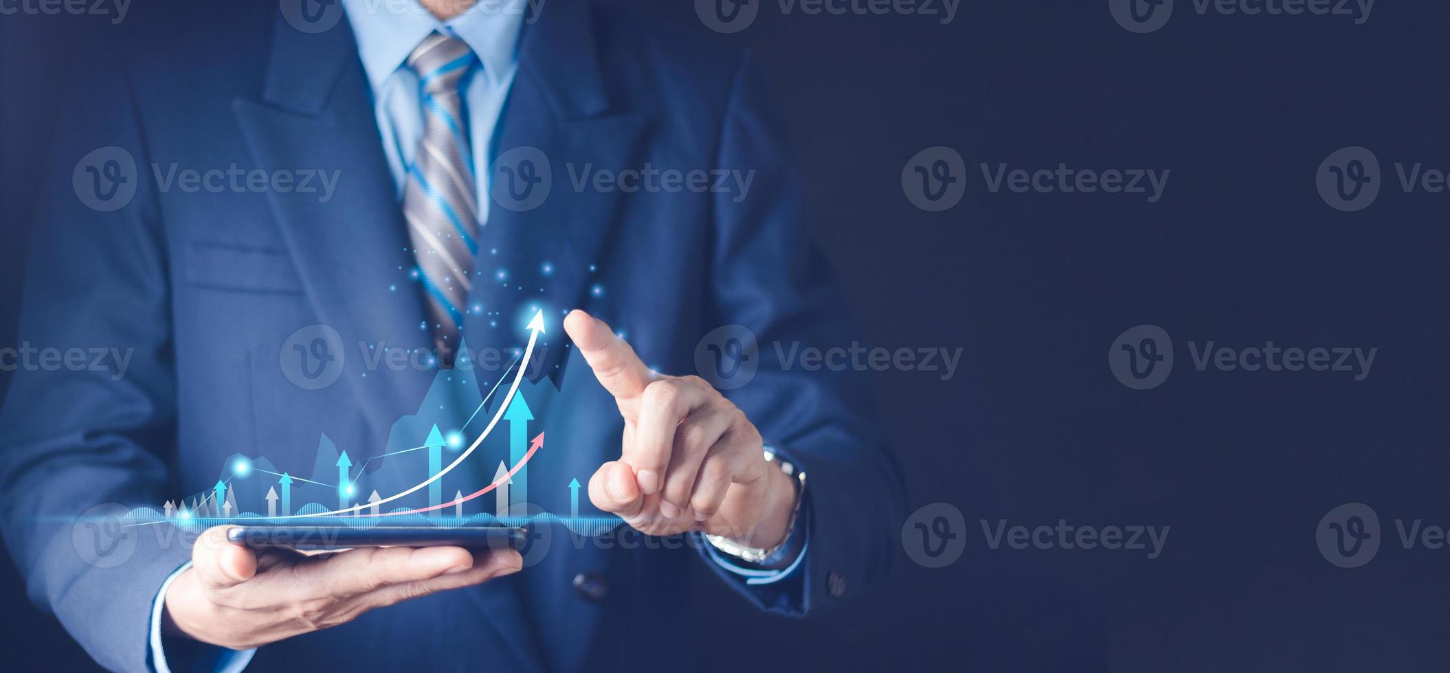 planning and strategy, Stock market, Business growth, progress or success concept. Hand of Businessman or trader touching showing a growing virtual hologram stock on smartphone, invest in trading. photo