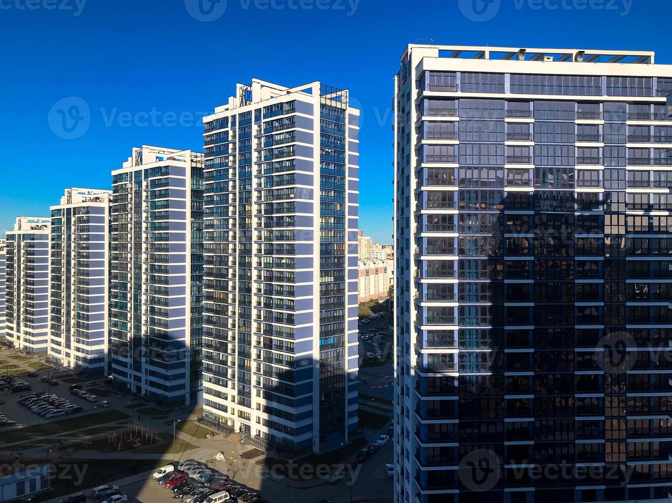 View of the new beautiful residential complex from new buildings with buildings houses monolithic concrete frame panel multi-story skyscrapers of the big city of the metropolis photo