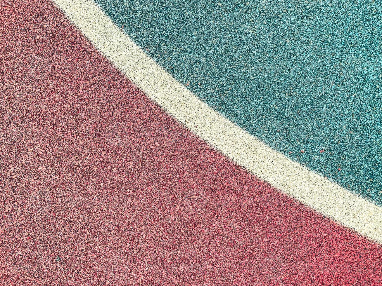 texture, background, basketball field. anti-slip coating for a sports field made of rubberized material. There are markings on the court for the players. photo