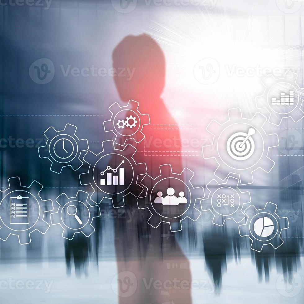 Business process automation concept. Gears and icons on abstract background. photo