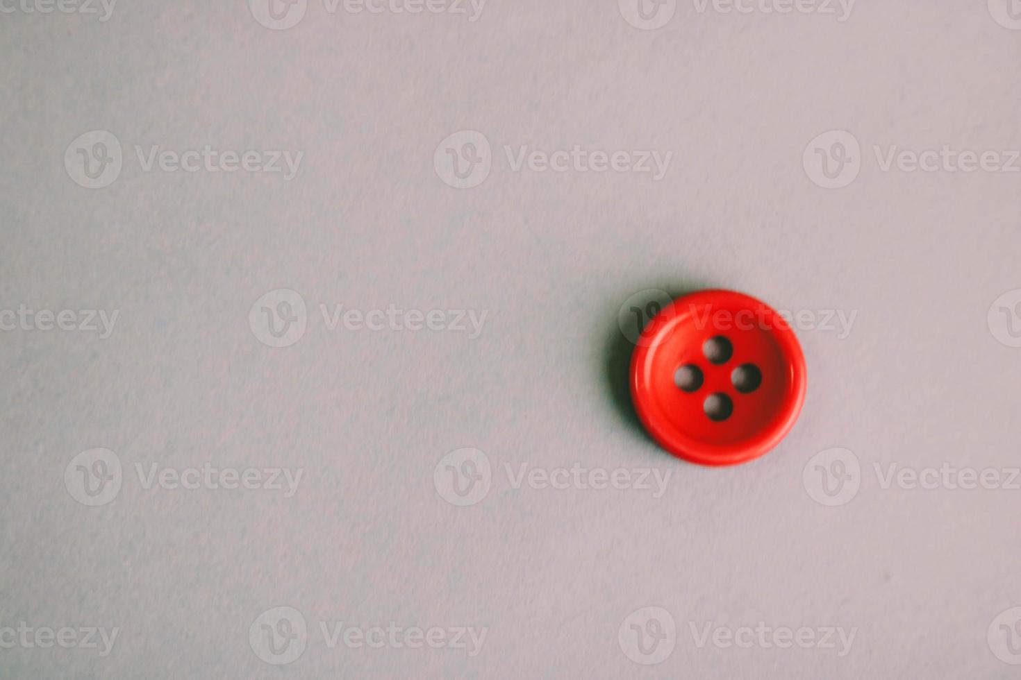 Beautiful texture with a round button for sewing, needlework. Copy space. Flat lay. Blue background photo