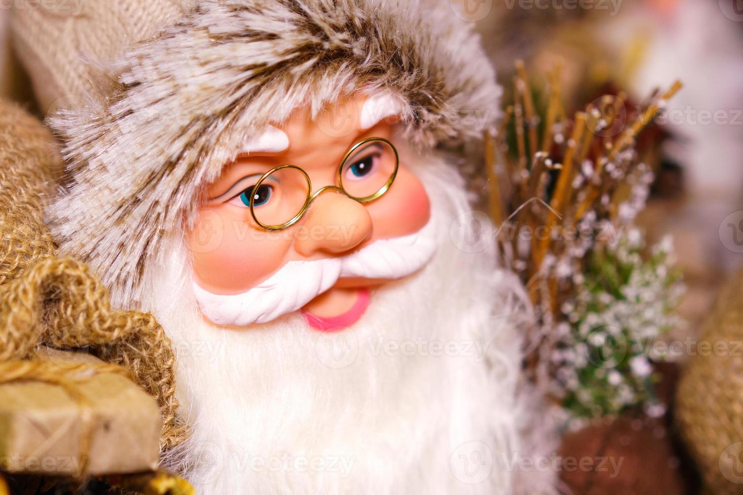 Souvenir doll of santa claus close up. Toy santa claus as a symbol of christmas photo