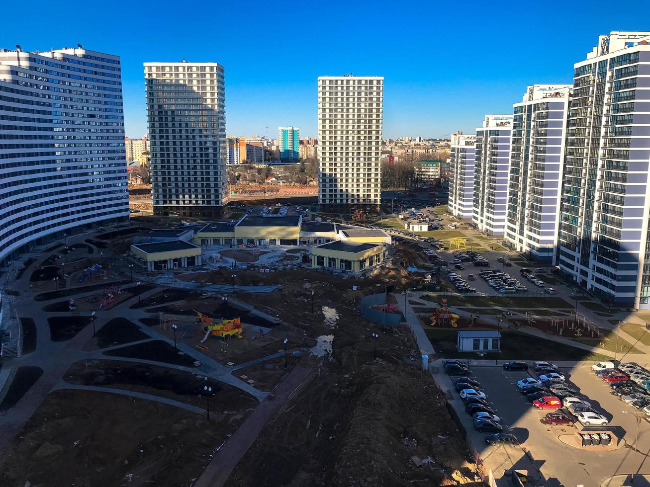 View of the new beautiful residential complex from new buildings with buildings houses monolithic concrete frame panel multi-story skyscrapers of the big city of the metropolis photo