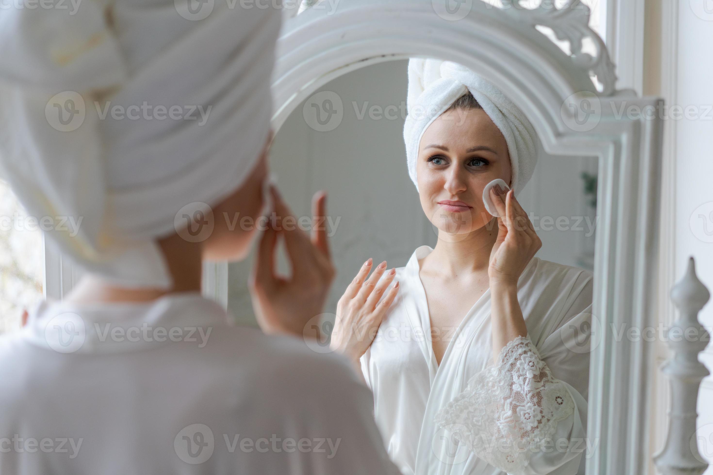 Closeup lovely woman after shower takes care clean skin and pores