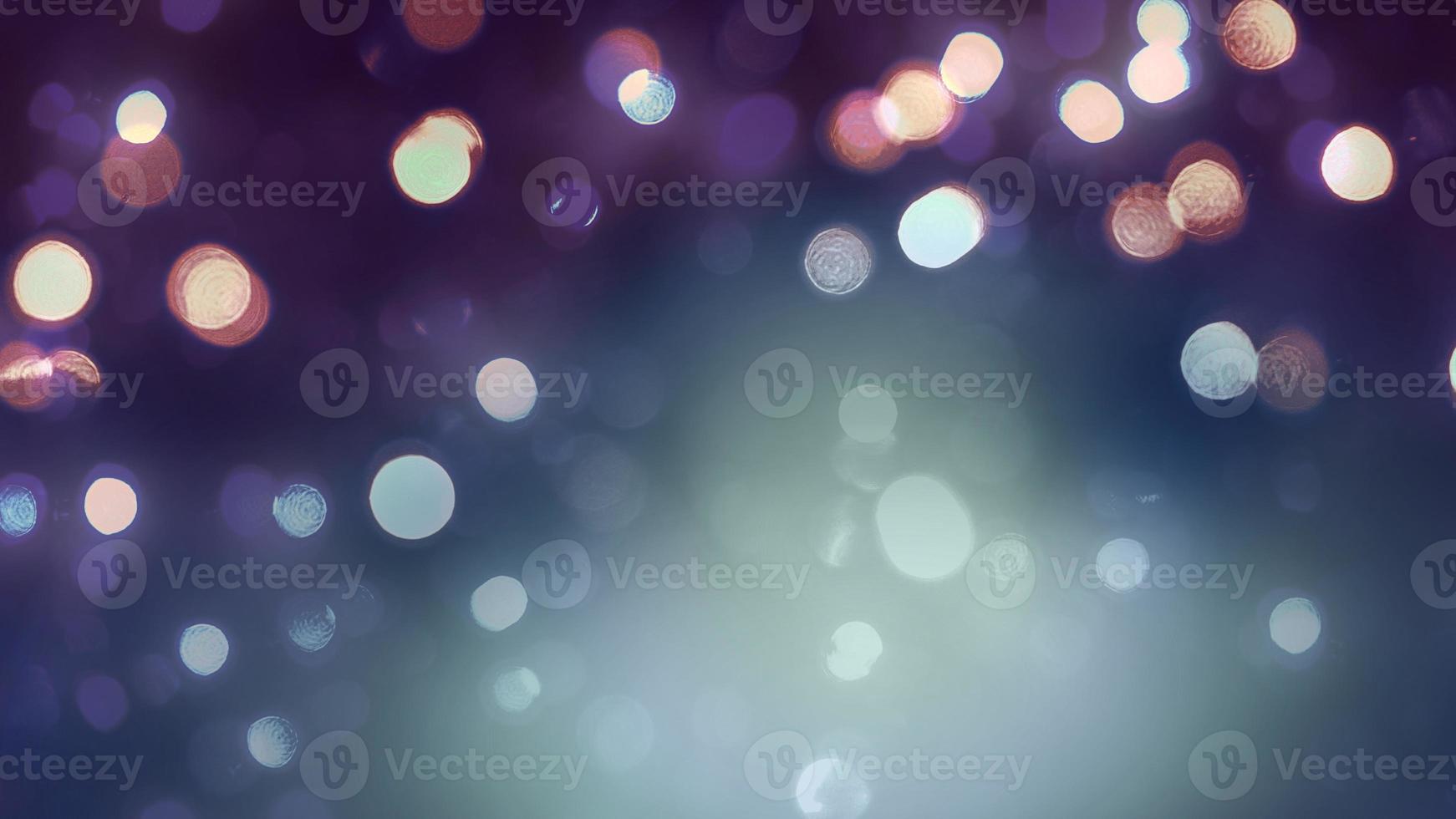 Composite image of bokeh style Christmas lights against a purple background. photo
